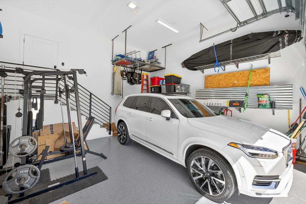 7301 South Elliott Street Tampa, FL 33616 - Photo 46 of 54 a car and bike parked in a garage