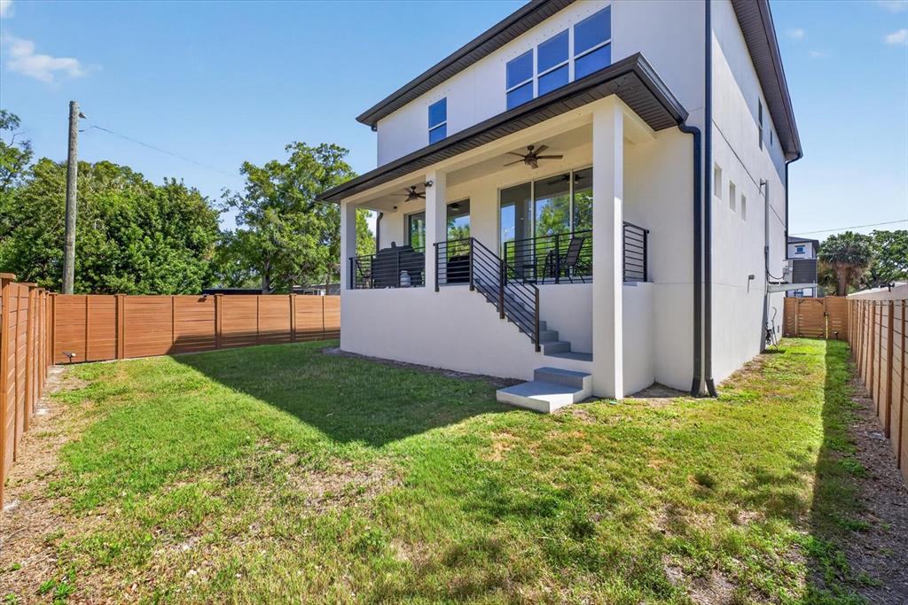 7301 South Elliott Street Tampa, FL 33616 - Photo 50 of 54 a view of a house with backyard and porch
