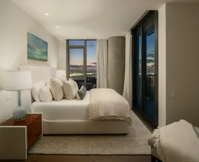 a living room with furniture and a walk in closet