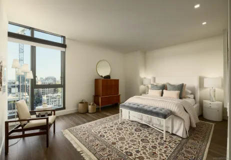 a bedroom with a large bed and a large window