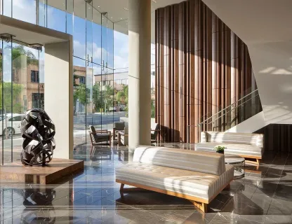 a living room filled with furniture and a large window
