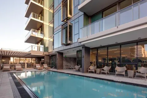 a view of a swimming pool with outdoor seating