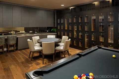 a dining room with furniture and wooden floor