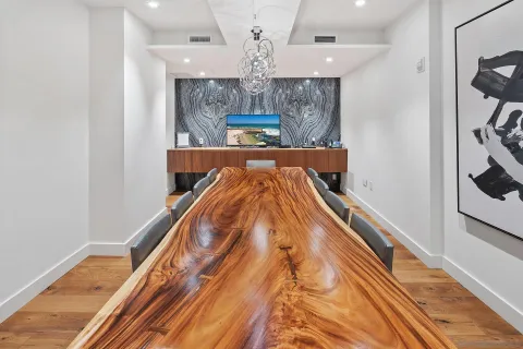 a view of kitchen and dining room with wooden floor