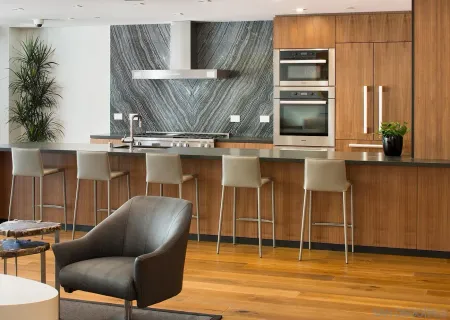 a kitchen with a chair a table and chairs