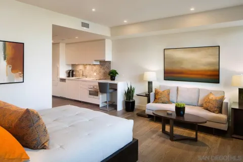 a bedroom with a bed and a couch