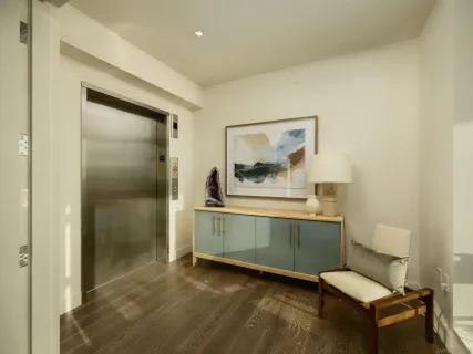 a room with a bed and a dresser