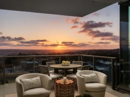 a terrace with outdoor seating ocean view