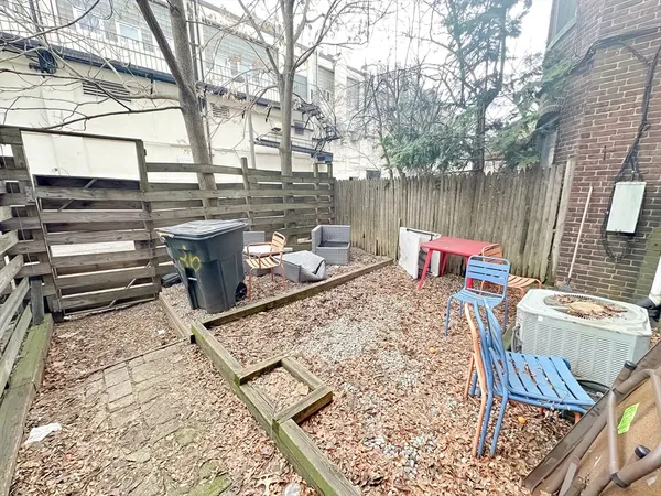 a outdoor sitting area with furniture and wooden floor