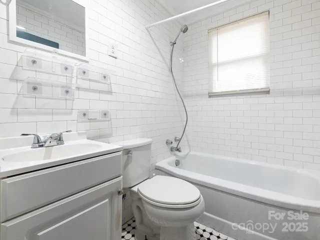 a bathroom with a sink a toilet and a bathtub