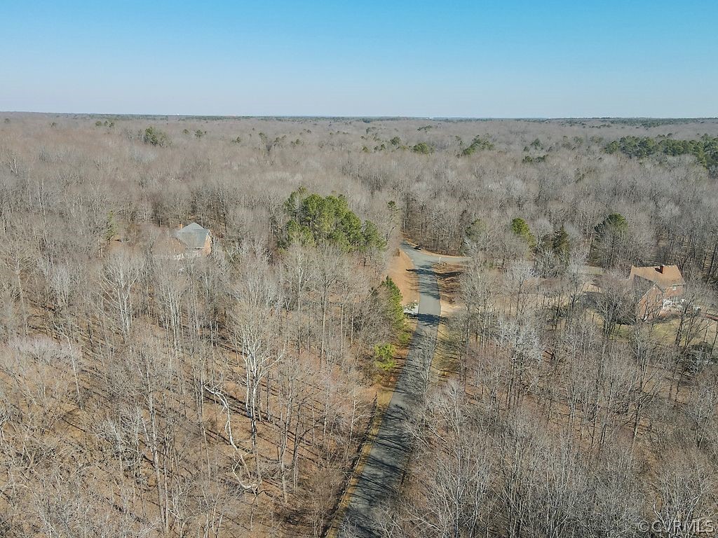 620 Cross Ridge Lane Manakin-Sabot, VA 23103 - Photo 15 of 17 a view of a dry field with trees in the background
