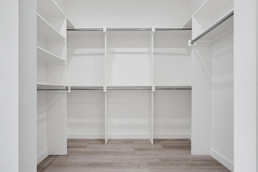 510 South O Connor Road Irving, TX 75060 - Photo 16 of 22 White built-in closet system featuring multiple shelving units and chrome hanging rods