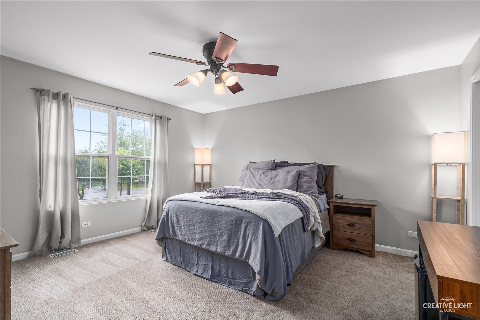 616 Springbrook Trail North Oswego, IL 60543 - Photo 15 of 18 a bedroom with a bed and a window