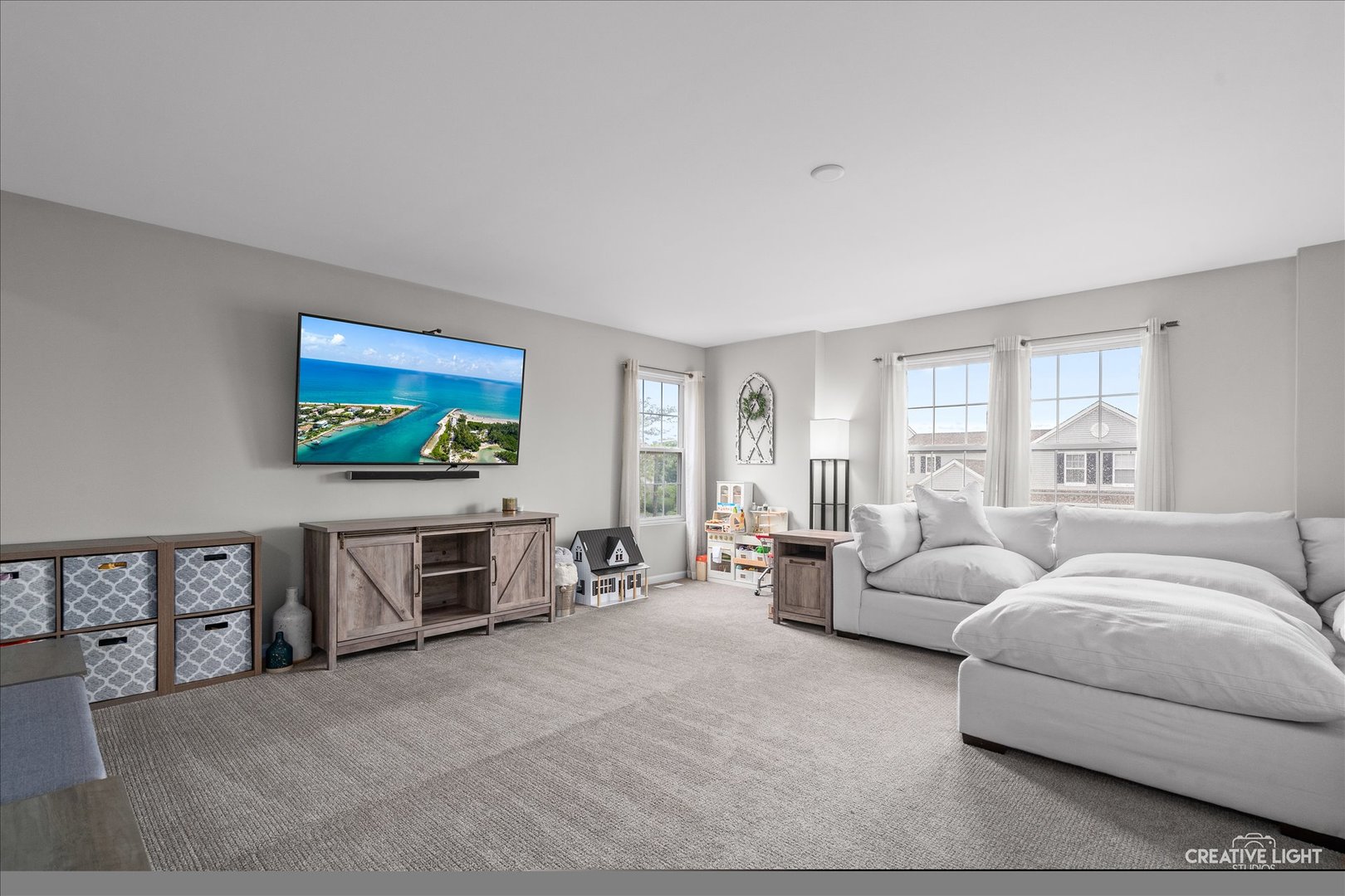 616 Springbrook Trail North Oswego, IL 60543 - Photo 2 of 18 a living room with furniture and a flat screen tv