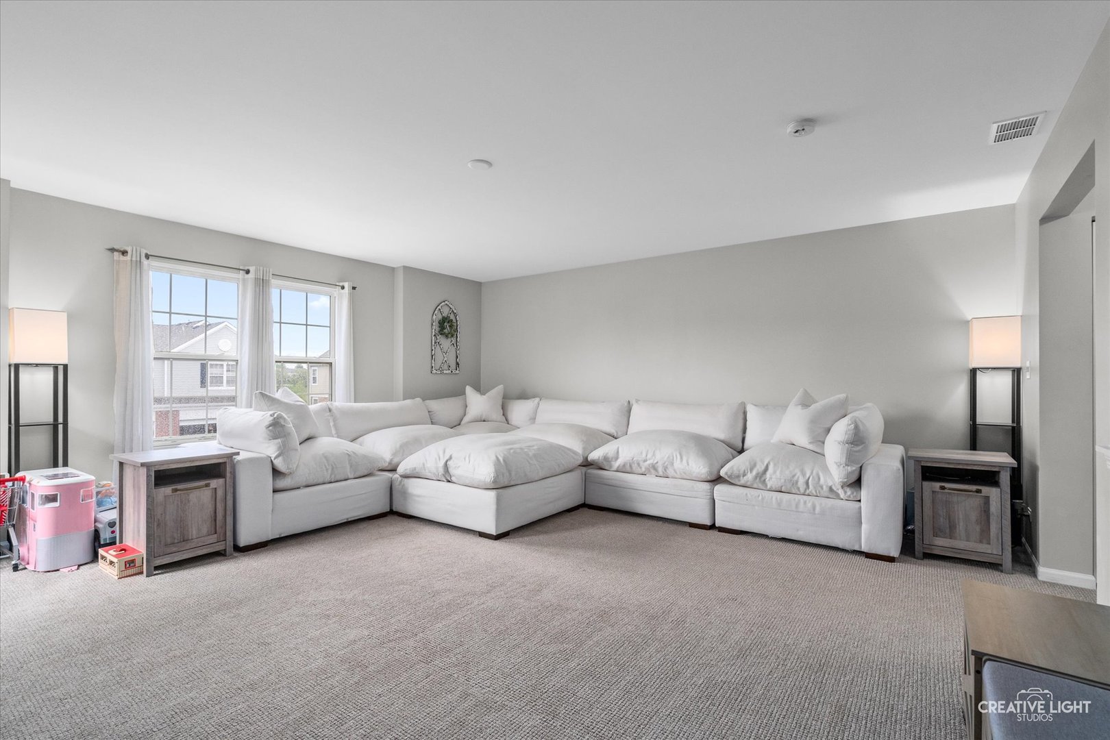 616 Springbrook Trail North Oswego, IL 60543 - Photo 3 of 18 a living room with furniture large window and a lamp