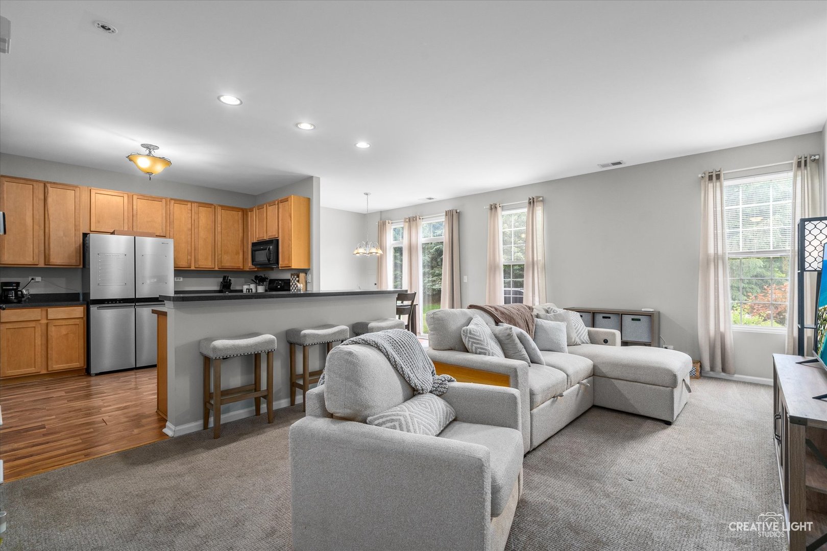 616 Springbrook Trail North Oswego, IL 60543 - Photo 8 of 18 a living room with furniture and a view of kitchen