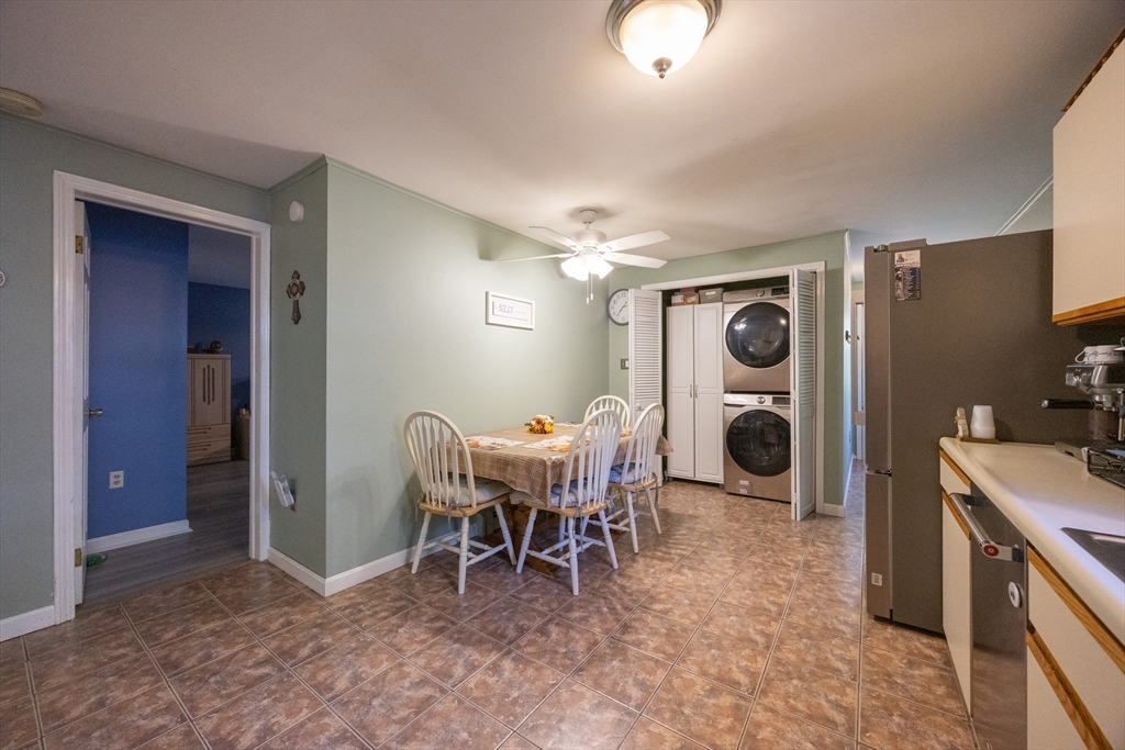 11 Edgeworth Street Billerica, MA 01821 - Photo 16 of 40 a dining room with a sink a dining table and chairs