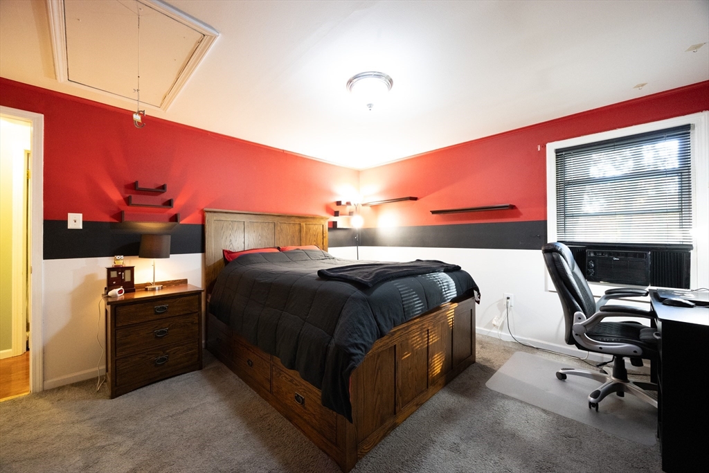11 Edgeworth Street Billerica, MA 01821 - Photo 17 of 40 a bedroom with a bed and a flat screen tv