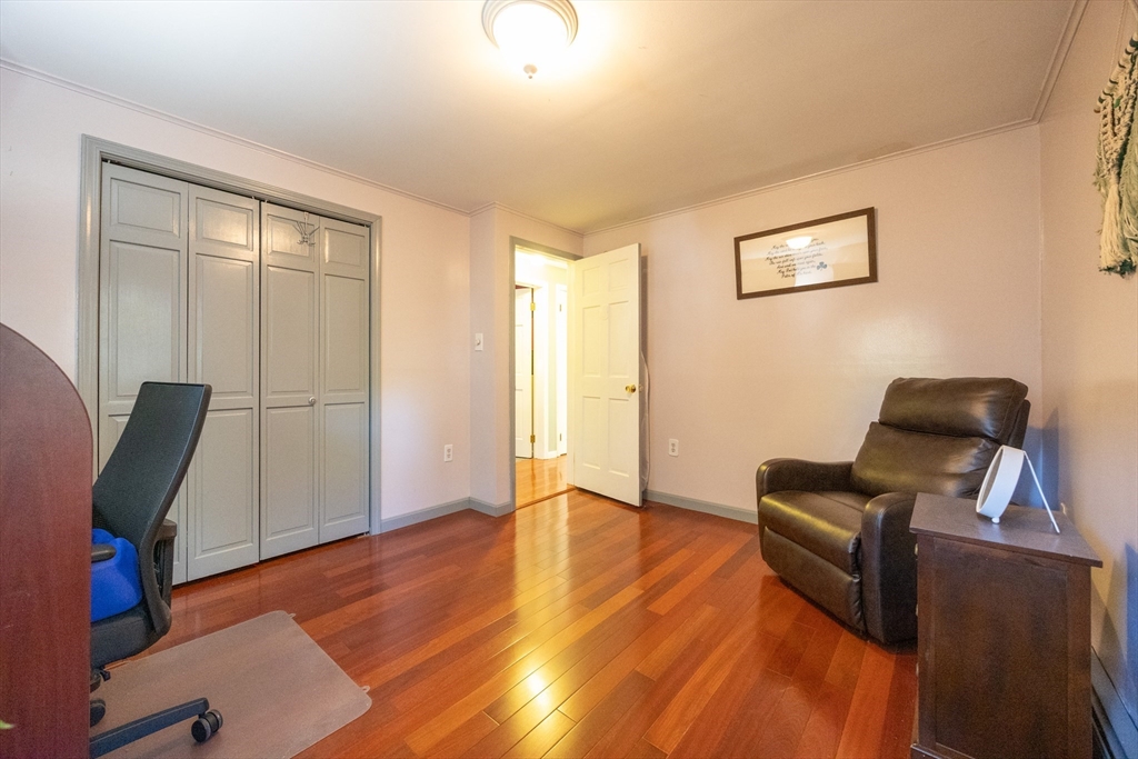 11 Edgeworth Street Billerica, MA 01821 - Photo 20 of 40 a living room with furniture and a wooden floor