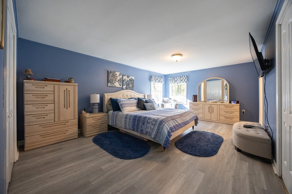 11 Edgeworth Street Billerica, MA 01821 - Photo 2 of 40 a bedroom with a large bed and a dresser
