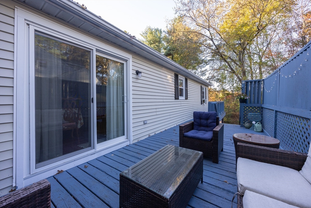 11 Edgeworth Street Billerica, MA 01821 - Photo 39 of 40 a view of a wooden chairs on the deck