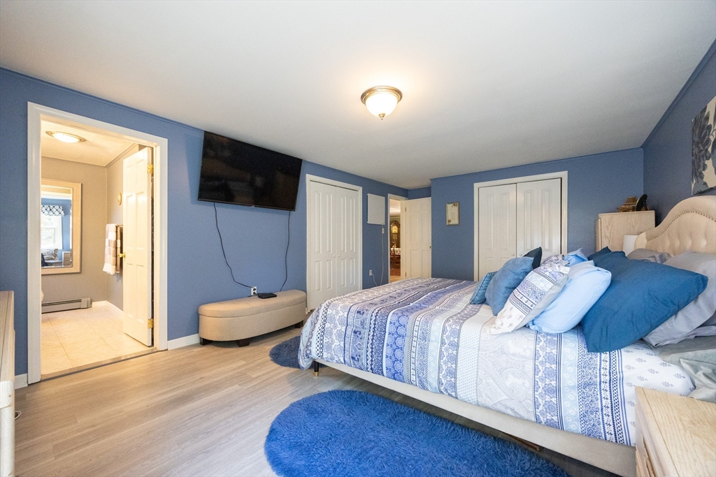11 Edgeworth Street Billerica, MA 01821 - Photo 4 of 40 a bedroom with a bed and a television