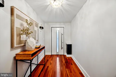 a kitchen with stainless steel appliances granite countertop a sink and wooden cabinets