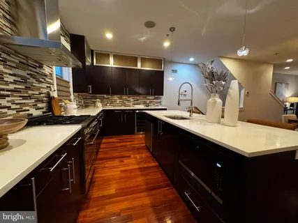 a living room with furniture a window and a fireplace