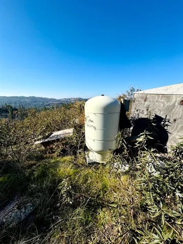 a view of a back yard of the building and mountain view