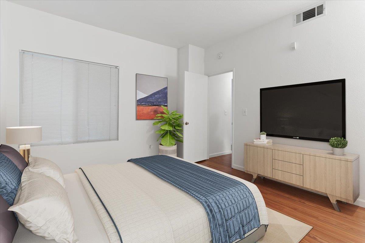 1403 Forest Run Hercules, CA 94547 - Photo 11 of 26 a bedroom with a bed and a flat screen tv