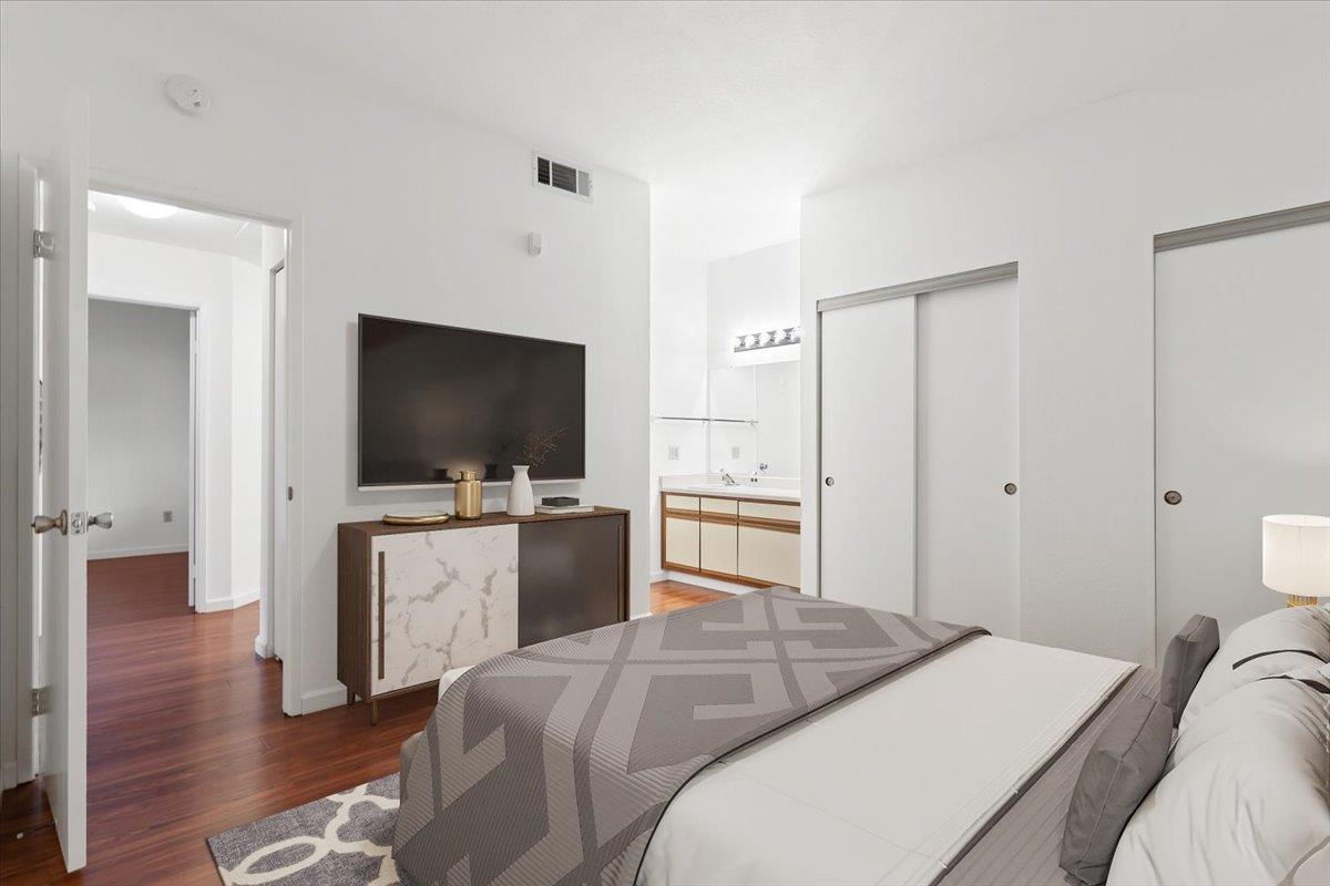 1403 Forest Run Hercules, CA 94547 - Photo 8 of 26 a bedroom with a bed and a flat screen tv
