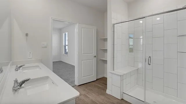 a bathroom with a sink and shower