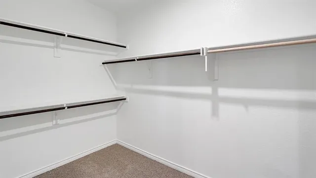 a view of an empty walk in closet