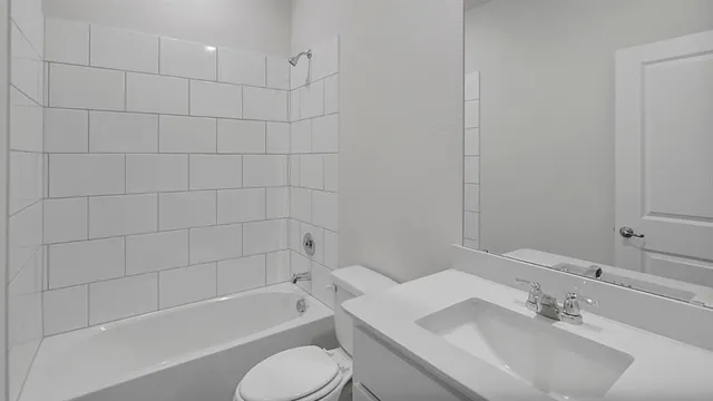 a bathroom with a sink toilet and bathtub