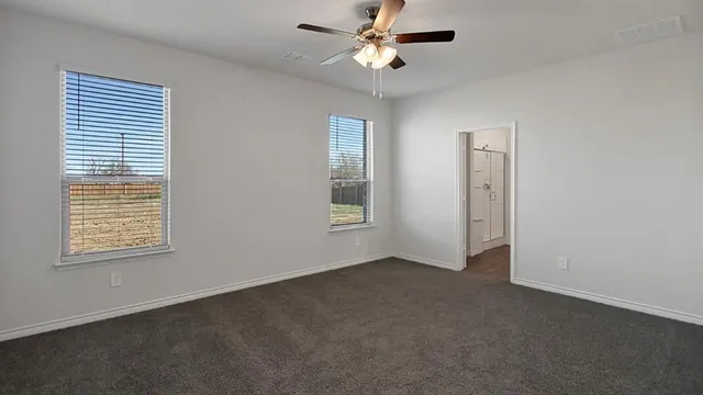 a view of an empty room with a window