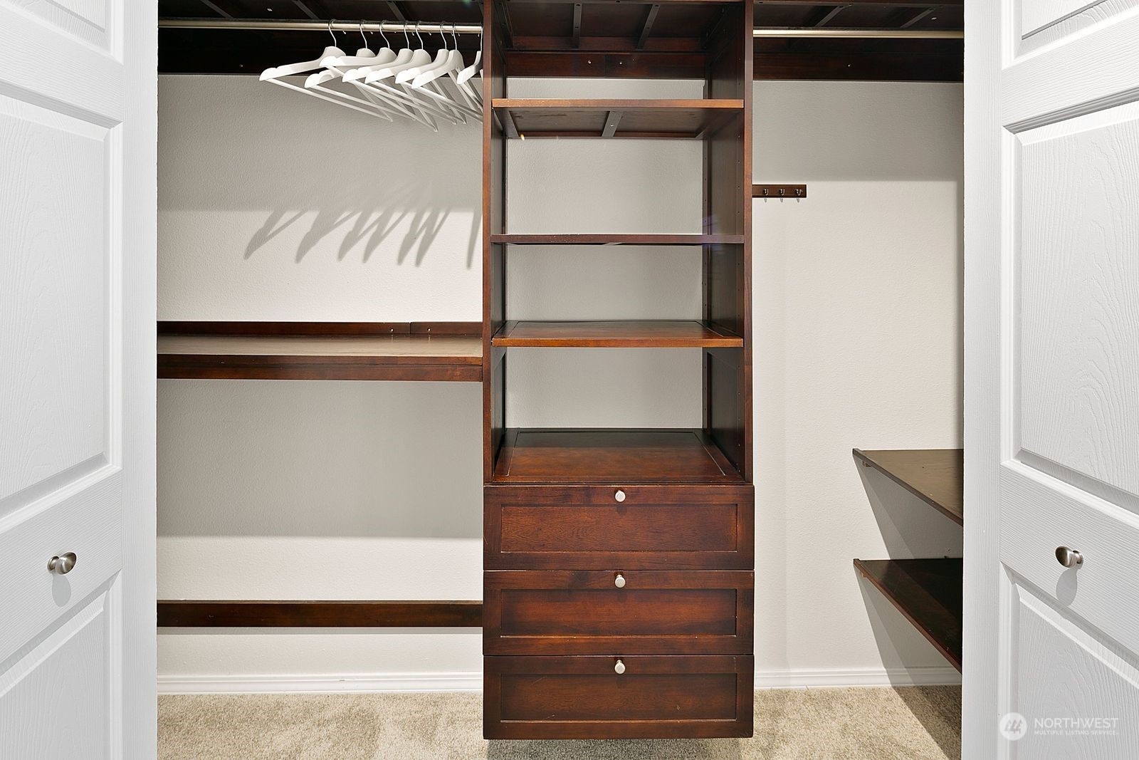 8512 242nd Street Southwest, Unit 4 Edmonds, WA 98026 - Photo 16 of 24 a view of walk in closet with clothes and shoes