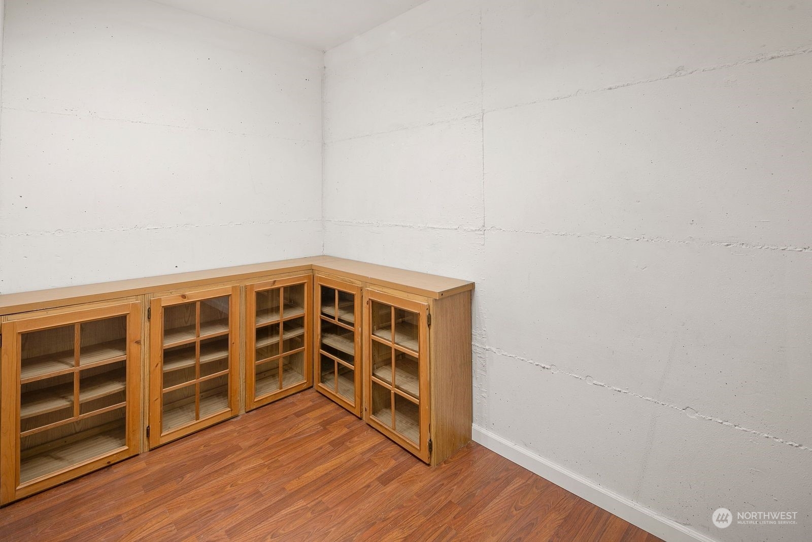 8512 242nd Street Southwest, Unit 4 Edmonds, WA 98026 - Photo 21 of 24 a view of an empty room with wooden floor and closet