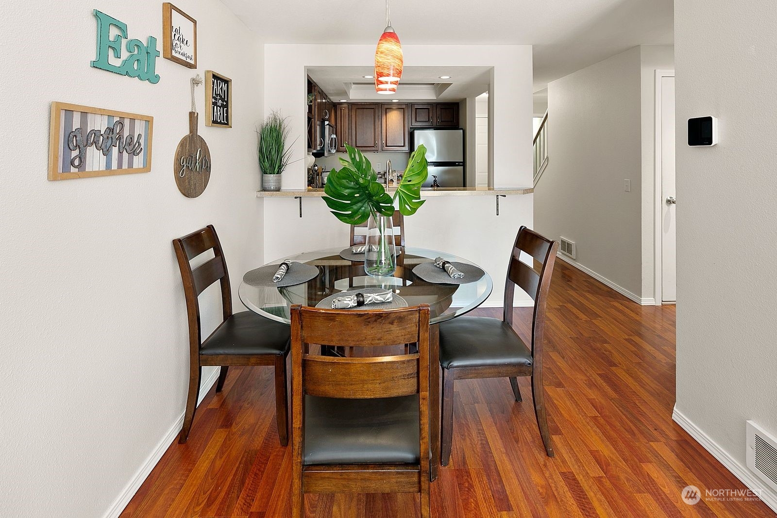 8512 242nd Street Southwest, Unit 4 Edmonds, WA 98026 - Photo 8 of 24 a dining room with furniture and wooden floor