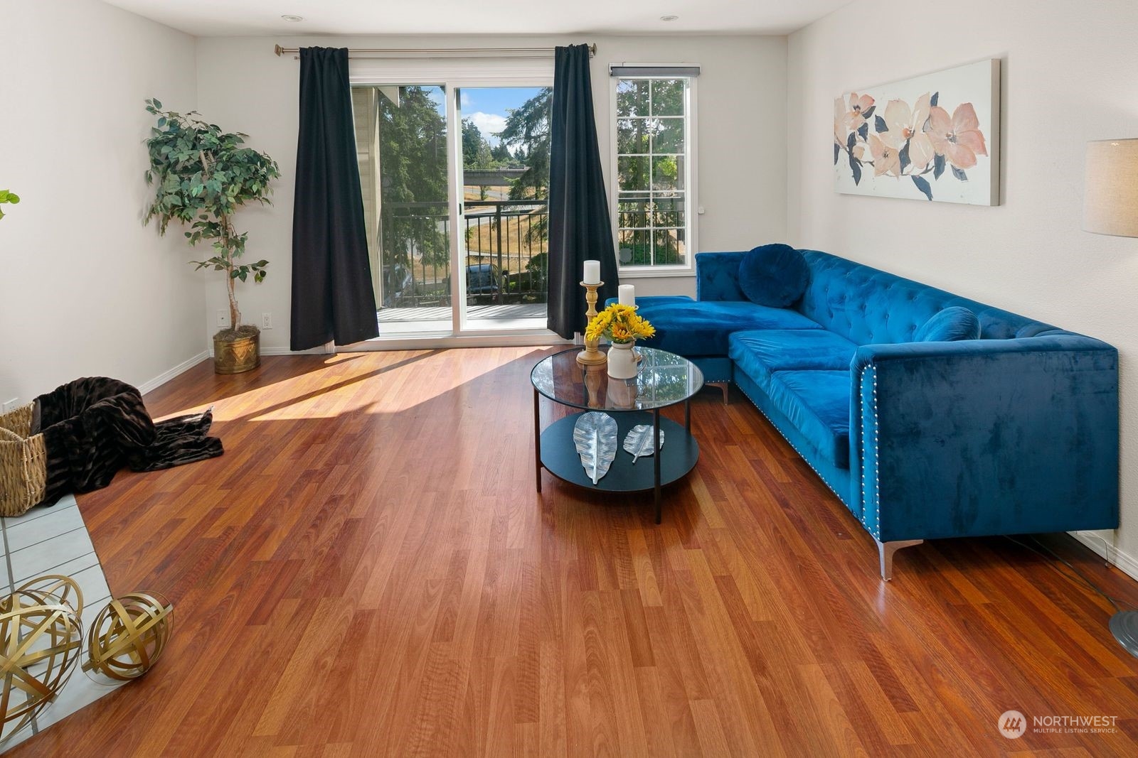 8512 242nd Street Southwest, Unit 4 Edmonds, WA 98026 - Photo 9 of 24 a living room with furniture and wooden floor