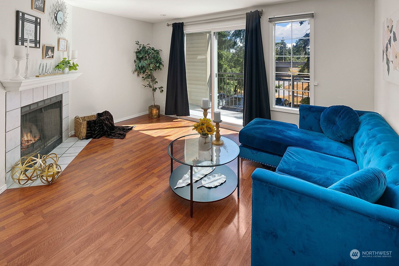 8512 242nd Street Southwest, Unit 4 Edmonds, WA 98026 - Photo 10 of 24 a living room with furniture a window and a fireplace