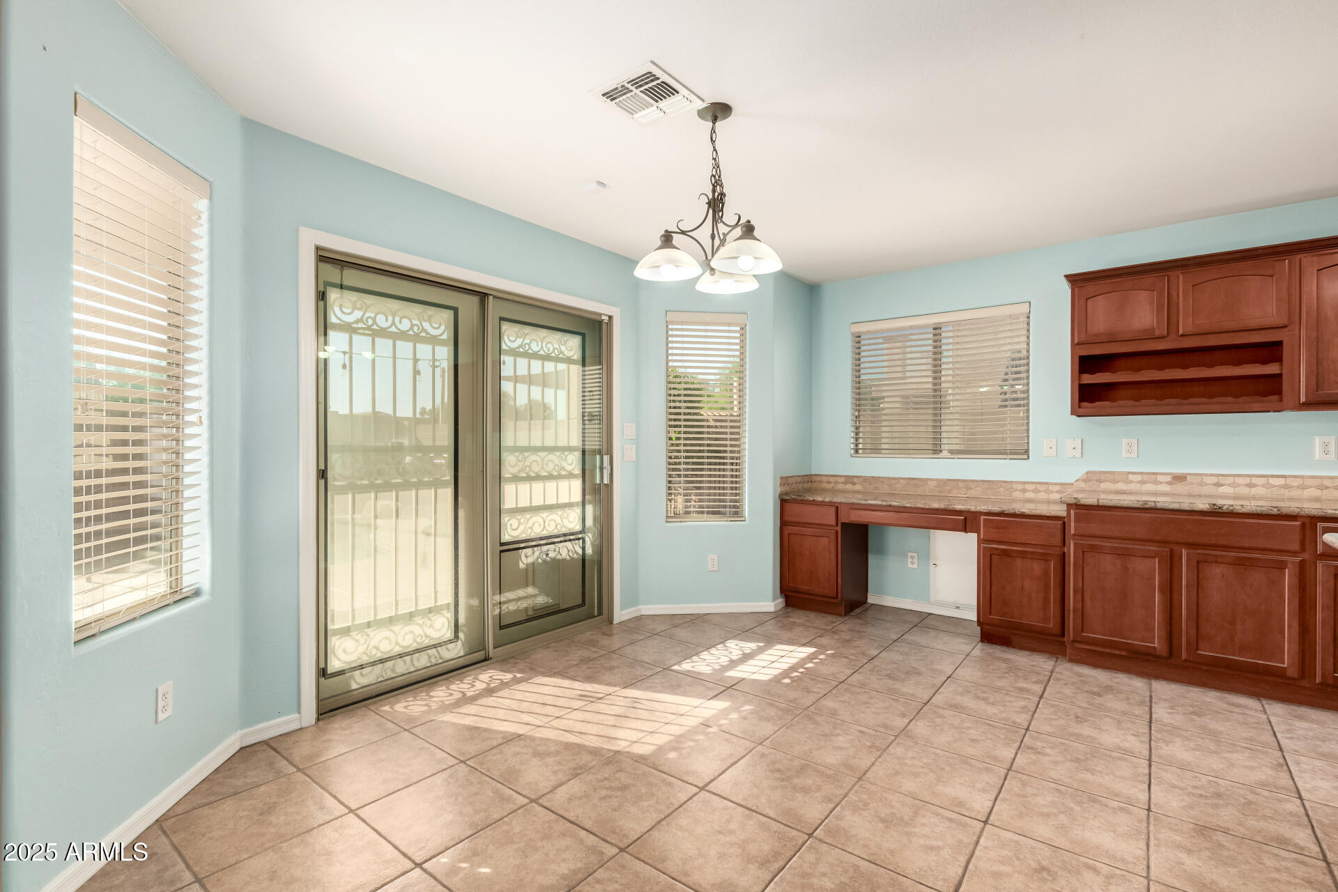 4403 West Maldonado Road Laveen, AZ 85339 - Photo 13 of 37 a spacious bathroom with a granite countertop sink a mirror and a shower
