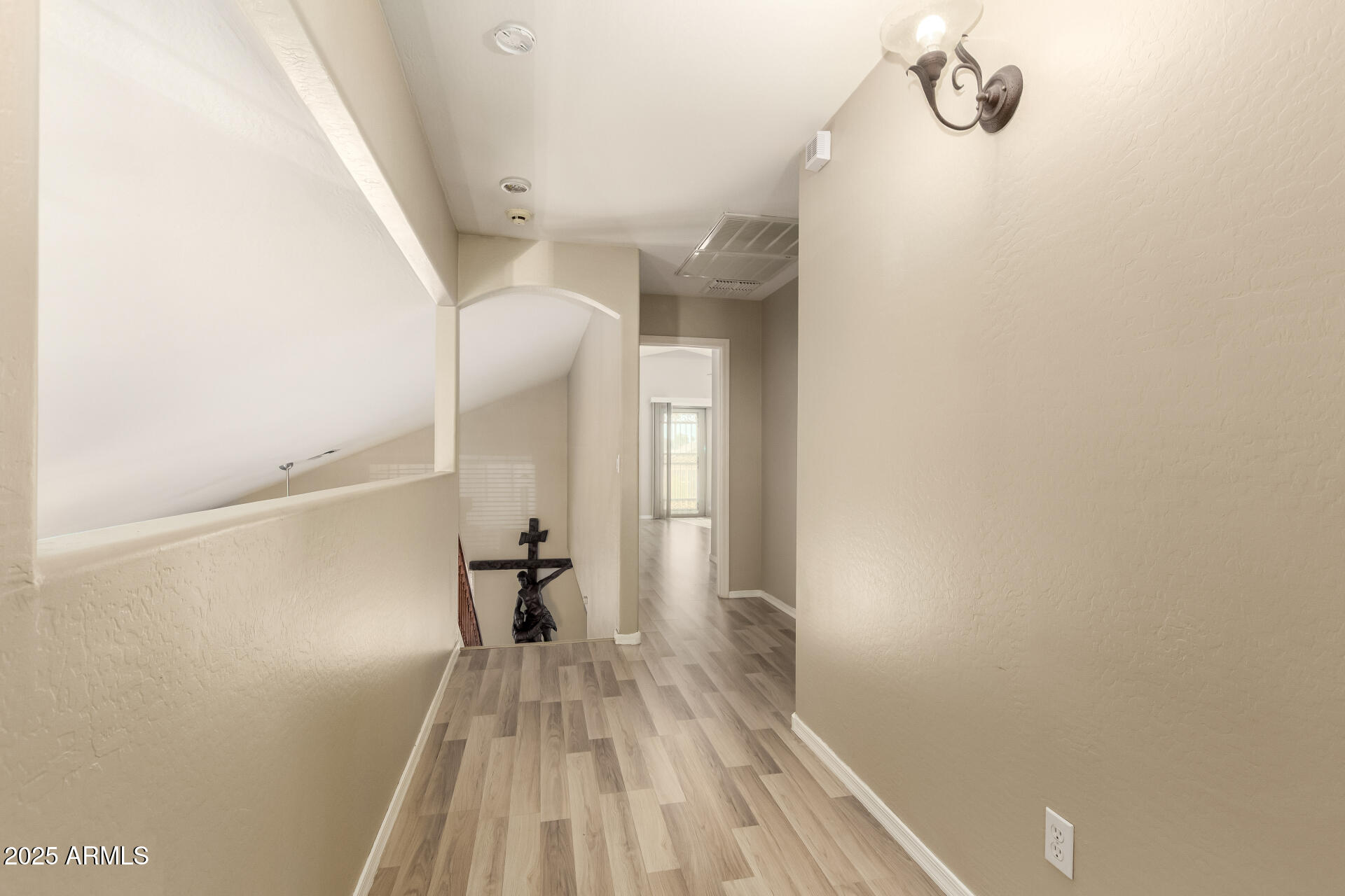 4403 West Maldonado Road Laveen, AZ 85339 - Photo 19 of 37 a view of a room with wooden floor and staircase