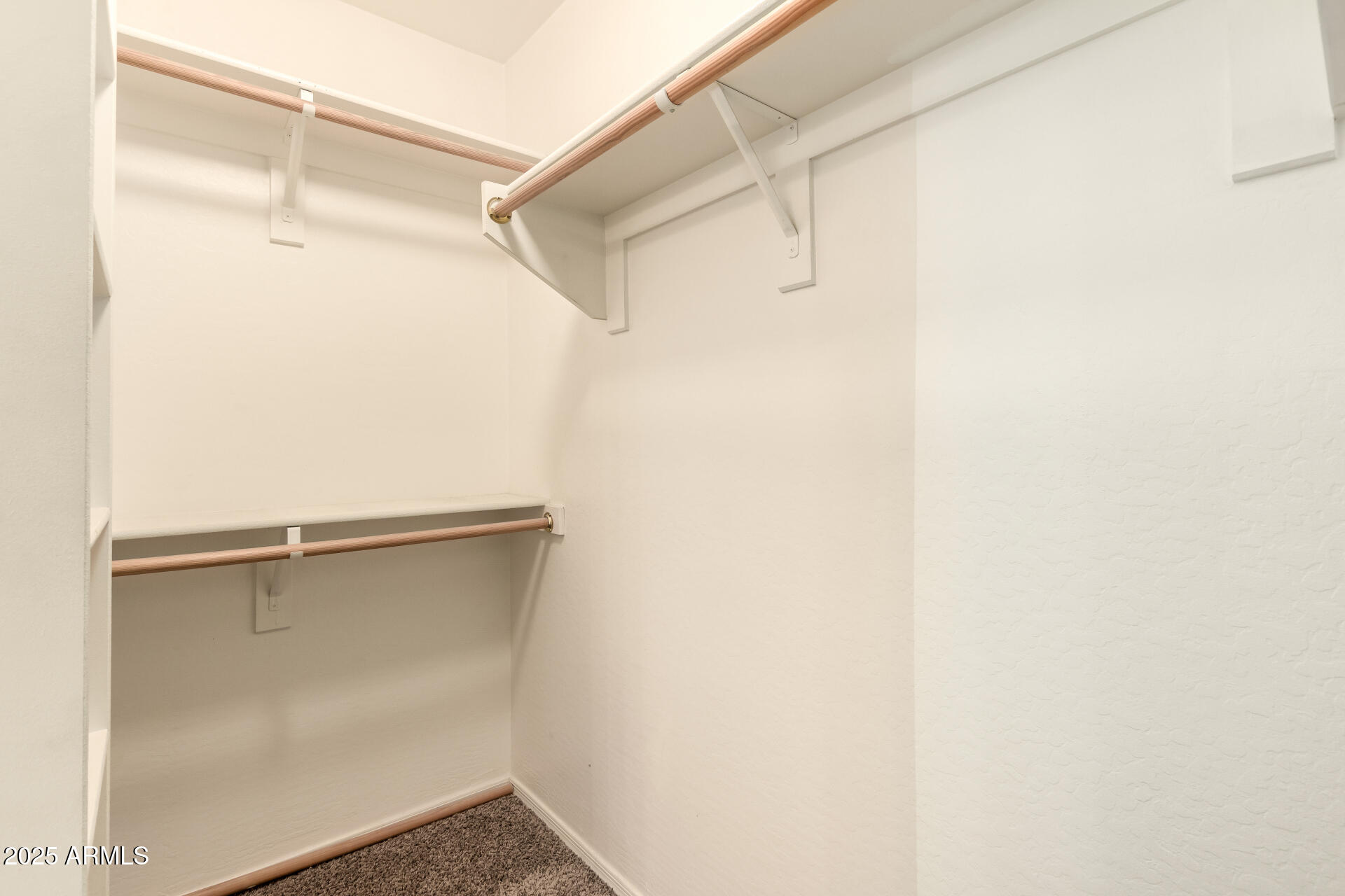 4403 West Maldonado Road Laveen, AZ 85339 - Photo 26 of 37 a view of an empty walk in closet