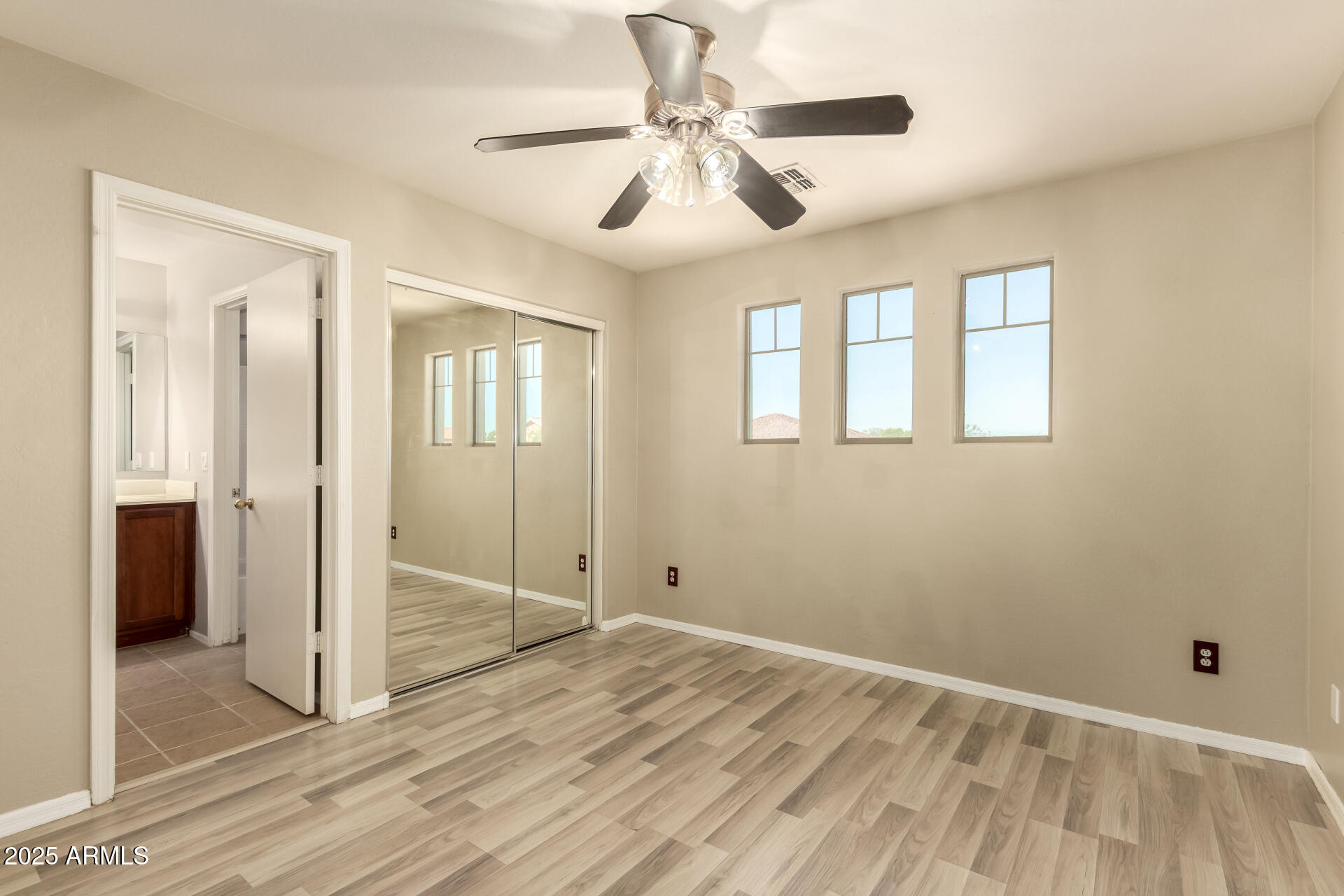 4403 West Maldonado Road Laveen, AZ 85339 - Photo 27 of 37 a view of empty room with wooden floor