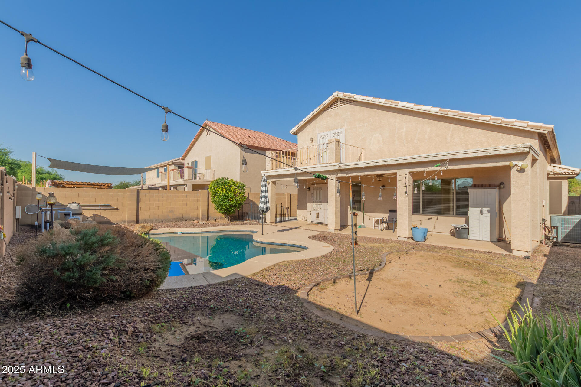 4403 West Maldonado Road Laveen, AZ 85339 - Photo 36 of 37 a view of a white house with a sink and yard