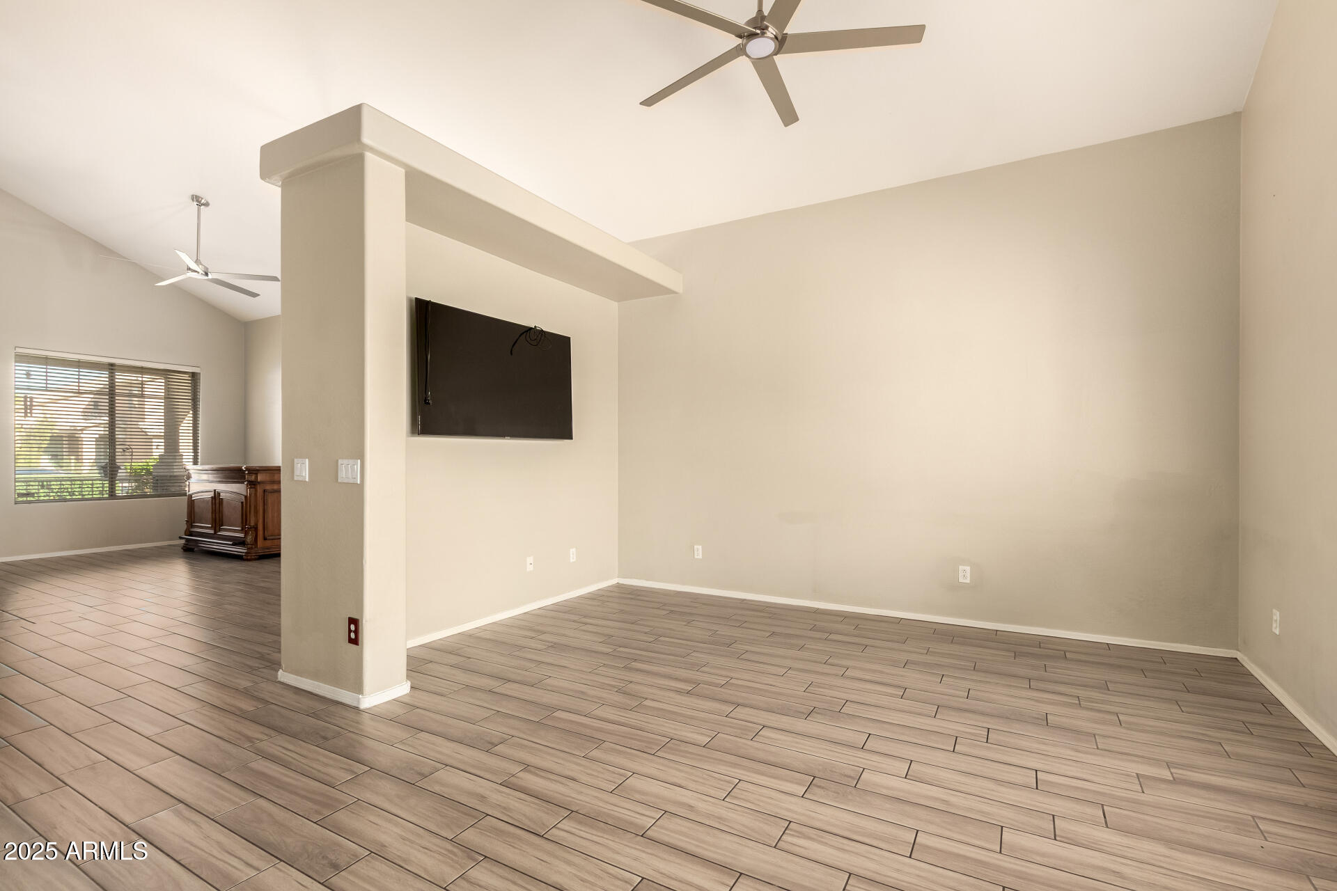4403 West Maldonado Road Laveen, AZ 85339 - Photo 9 of 37 a view of a livingroom with wooden floor and furniture