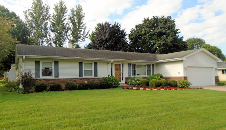 202 Linder Lane Rochelle, IL 61068 - Photo 1 of 17 a front view of a house with garden