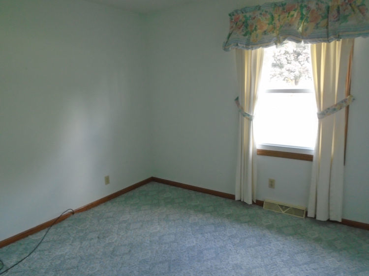 202 Linder Lane Rochelle, IL 61068 - Photo 8 of 17 a view of an empty room with a window