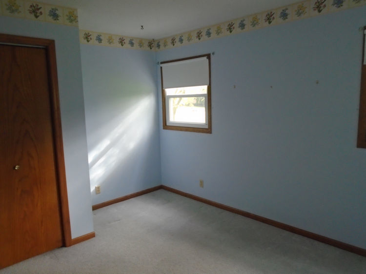 202 Linder Lane Rochelle, IL 61068 - Photo 10 of 17 an empty room with a window