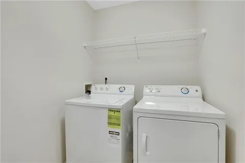 a view of an empty room and closet area